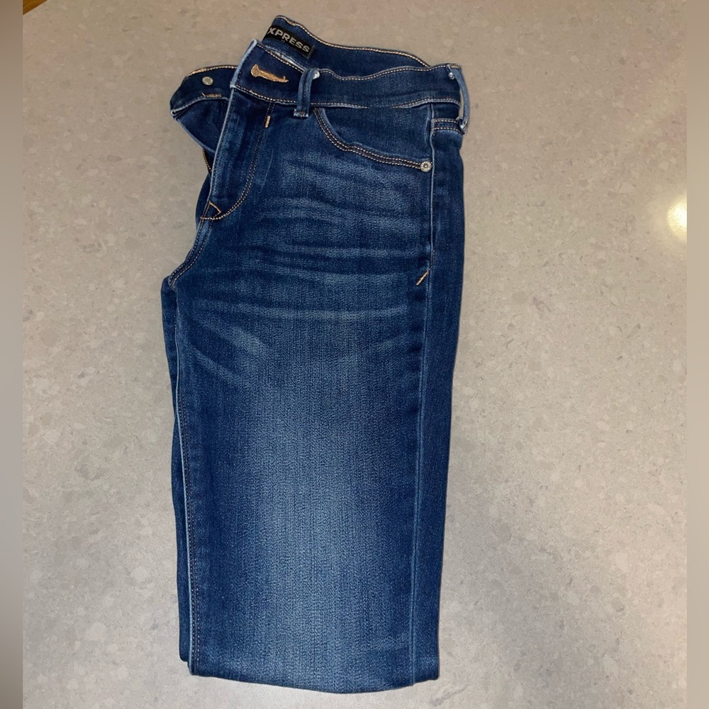 Express dark washed mid rise skinny jeans size 2